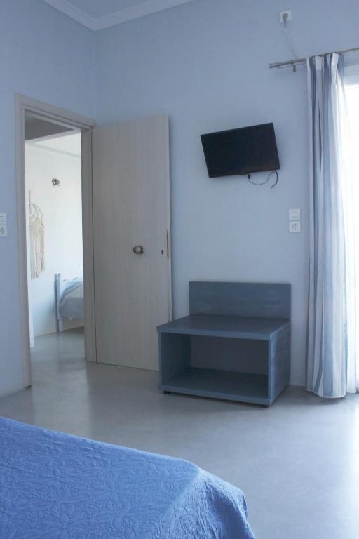 Telewizja i/lub zestaw kina domowego w obiekcie Passos Rooms