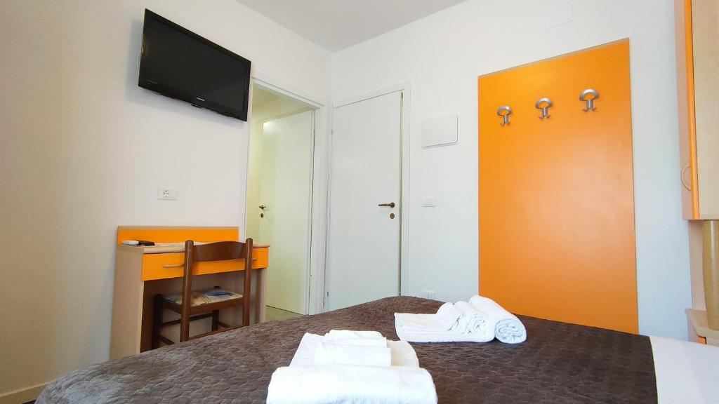 Postel nebo postele na pokoji v ubytování Hotel Esperia