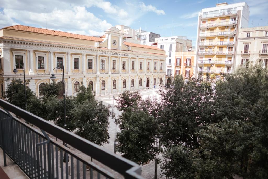 a view of a building in a city with trees at Kaktus B&B in Bari