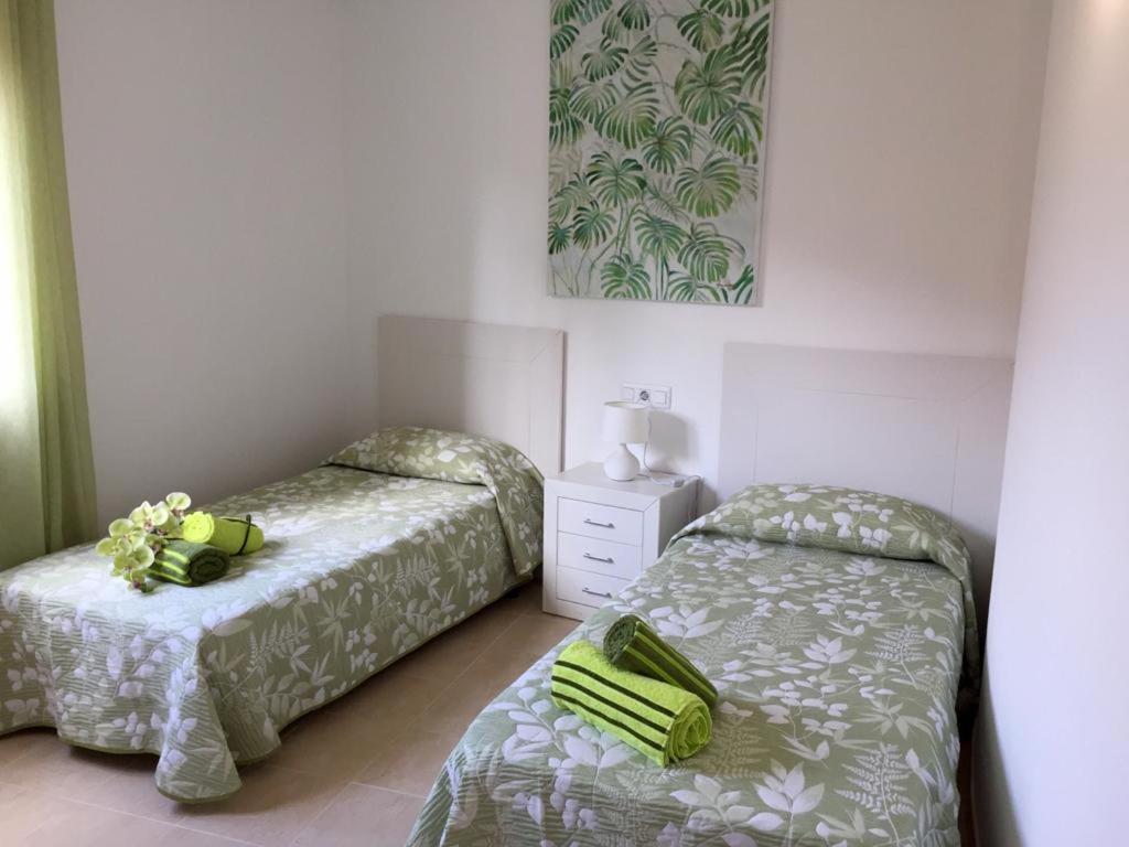 Postel nebo postele na pokoji v ubytování Villa Nella