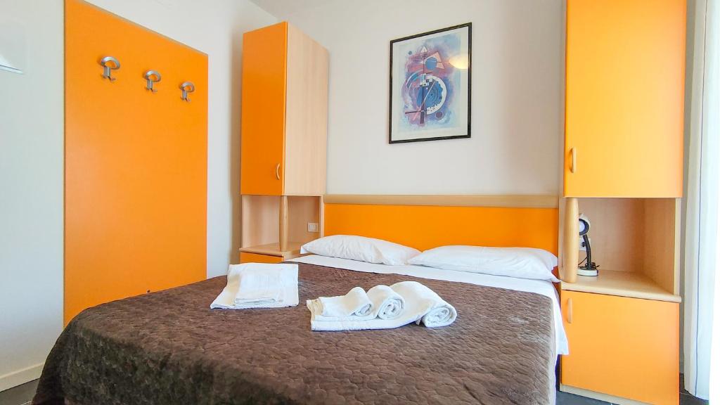 Postel nebo postele na pokoji v ubytování Hotel Esperia