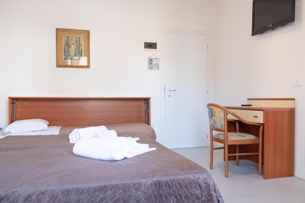 Postel nebo postele na pokoji v ubytování Hotel Esperia