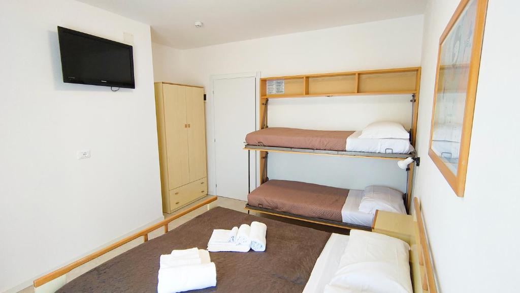 Postel nebo postele na pokoji v ubytování Hotel Esperia