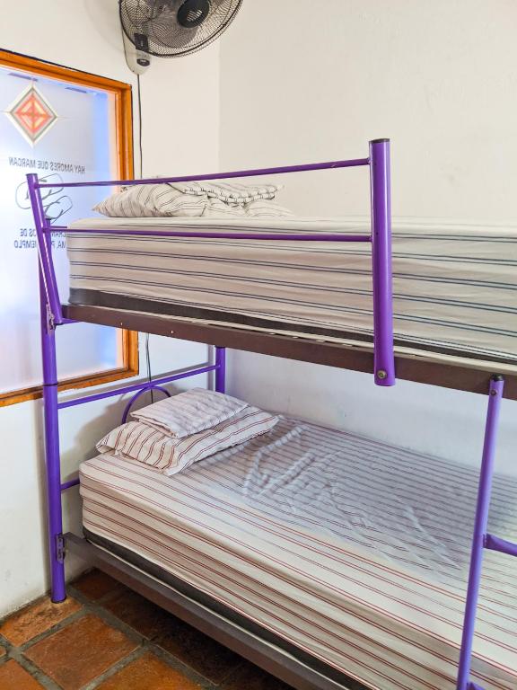 Postel nebo postele na pokoji v ubytování Chanclas Hostel Vallarta