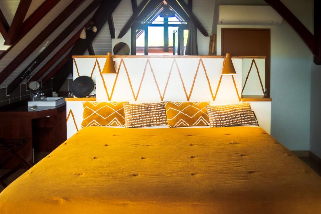 Postel nebo postele na pokoji v ubytování La Suite Villa