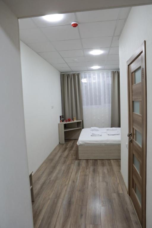Postel nebo postele na pokoji v ubytování Міні-Готель Білий Квадрат