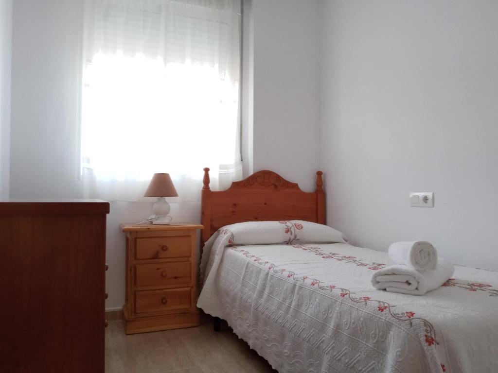 Posteľ alebo postele v izbe v ubytovaní Apartamento familiar.