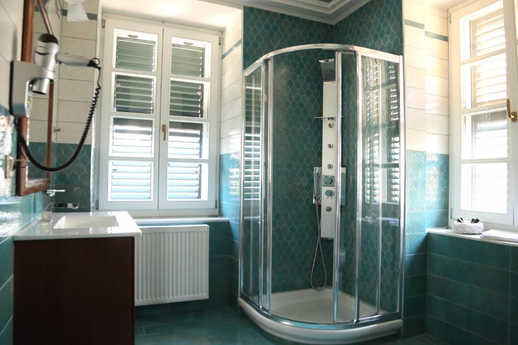 Koupelna v ubytování Nostos Hotel