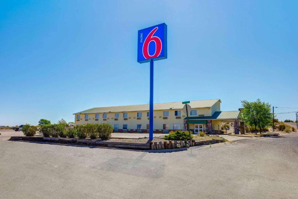 a no parking sign in front of a building at Motel 6-Truth Or Consequences, NM in Truth or Consequences