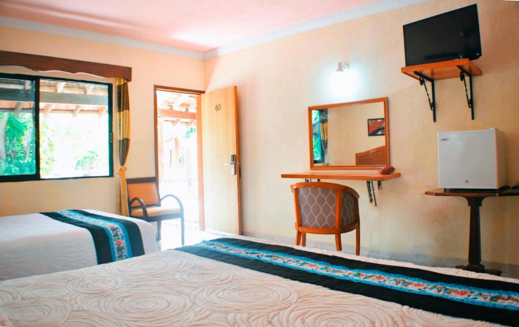 TV a/nebo společenská místnost v ubytování Hotel Hacienda Sánchez