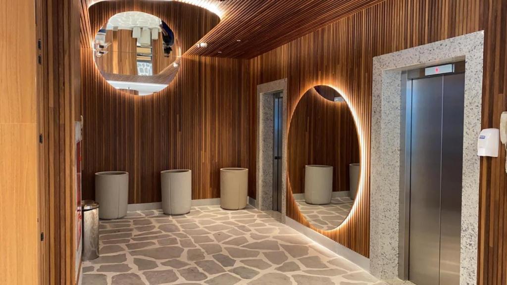 a bathroom with a row of sinks and mirrors at SALINAS EXCLUSIVE RESORT in Salinópolis