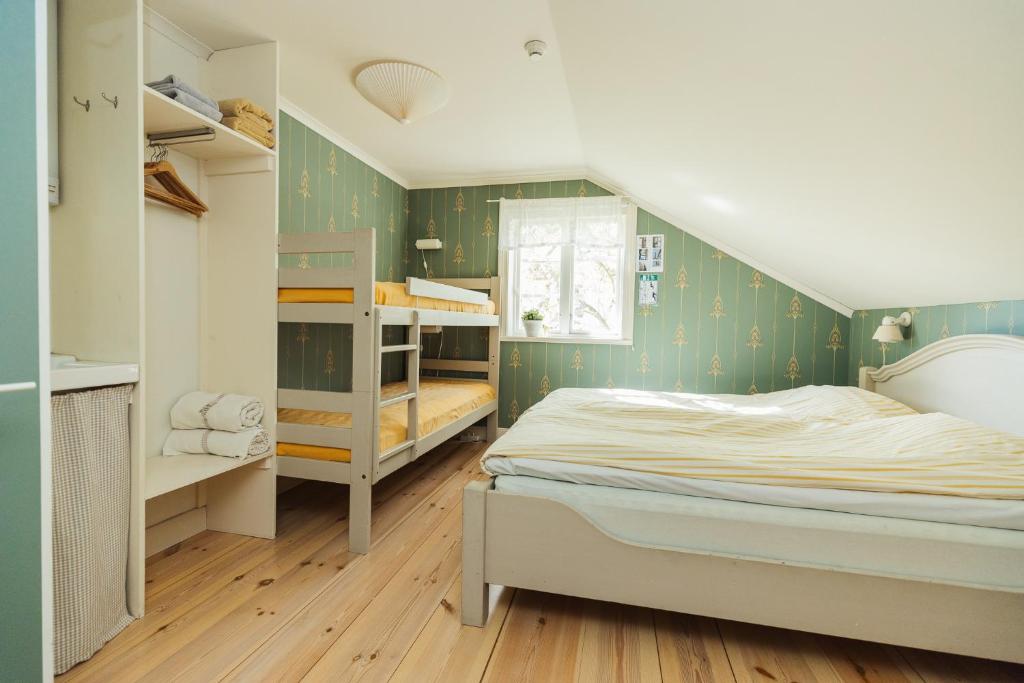 En eller flere senger på et rom på Bäcks Bed & Breakfast