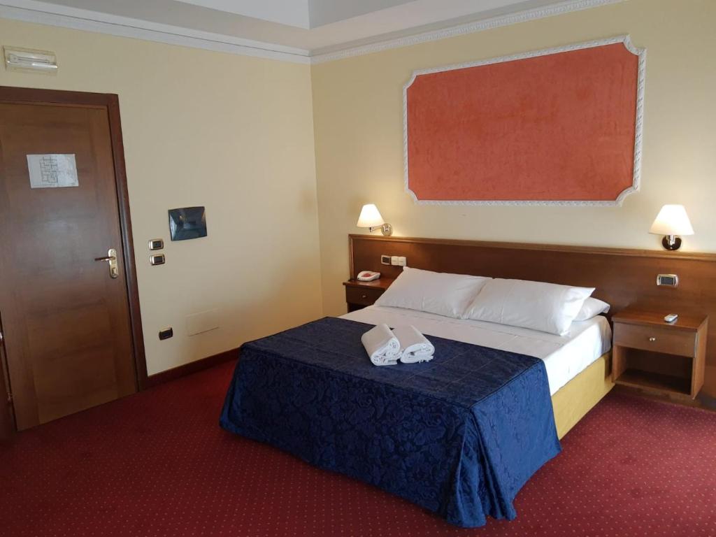 Postel nebo postele na pokoji v ubytování Hotel Antiche Terme Benevento