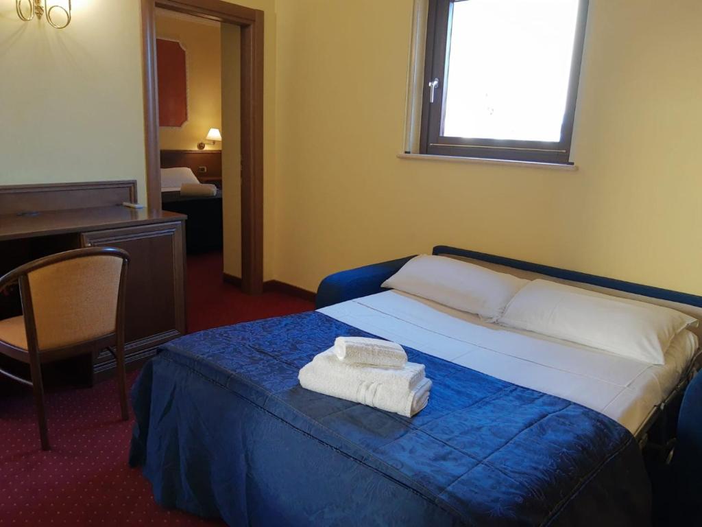Postel nebo postele na pokoji v ubytování Hotel Antiche Terme Benevento