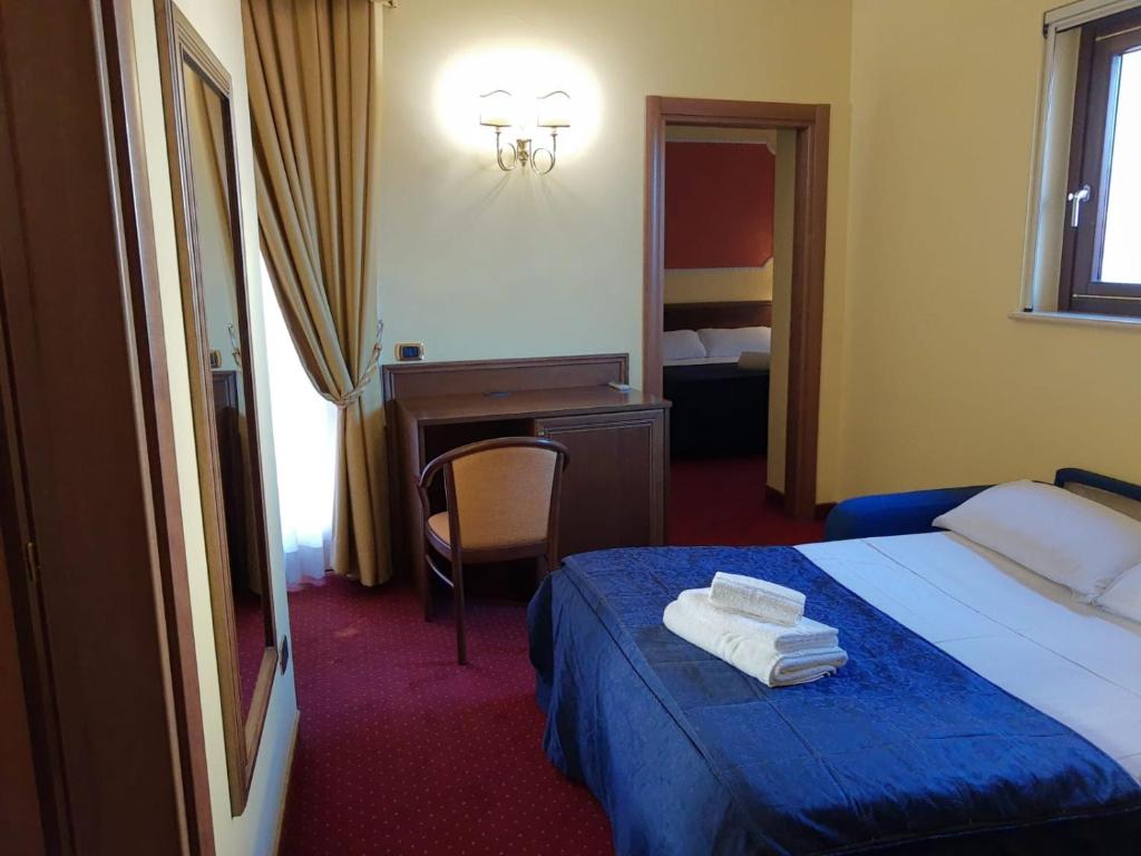 Postel nebo postele na pokoji v ubytování Hotel Antiche Terme Benevento