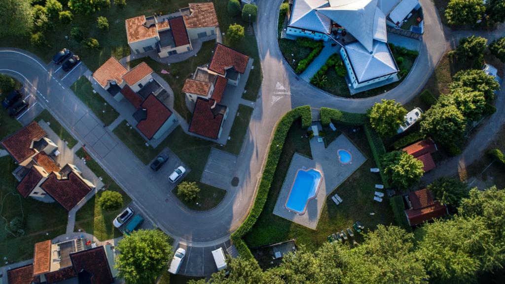 an overhead view of a suburb with houses and a road at Room in Holiday house - Albavillage residence Large apartment for 4 people in Alba