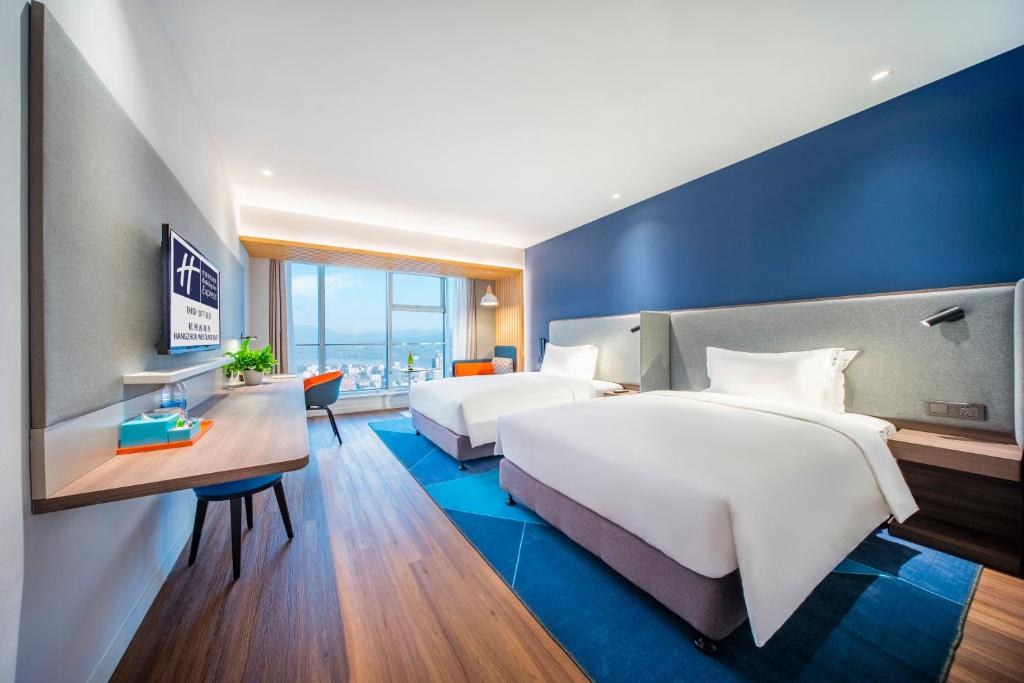 Holiday Inn Express Hangzhou Westlake East by IHGにあるベッド