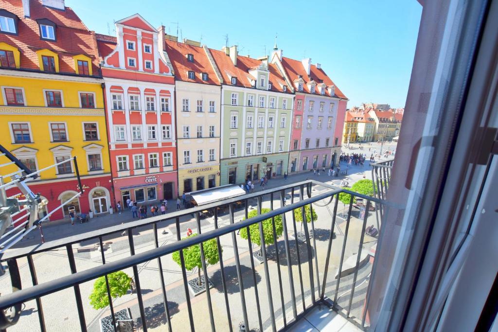 a view from a window of a street with buildings at City Central Apartments Wrocław in Wrocław