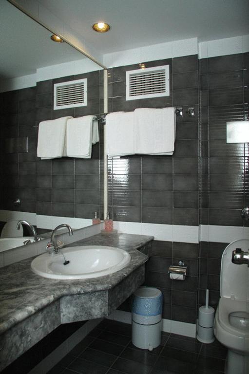 Koupelna v ubytování Mantenia Hotel