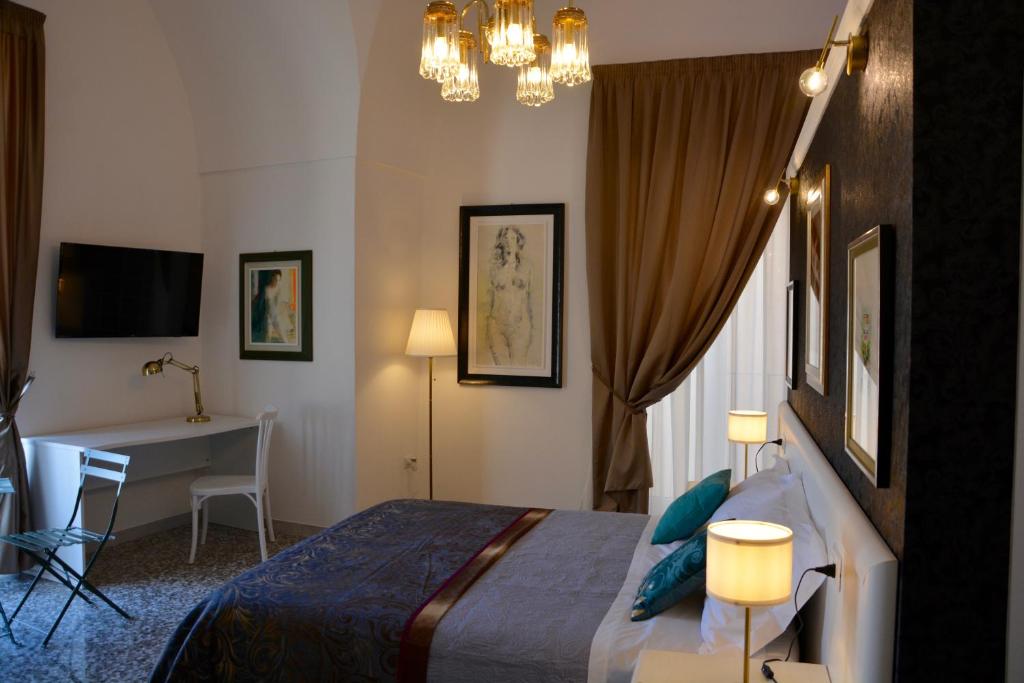 Postel nebo postele na pokoji v ubytování B&B dai Mimmi