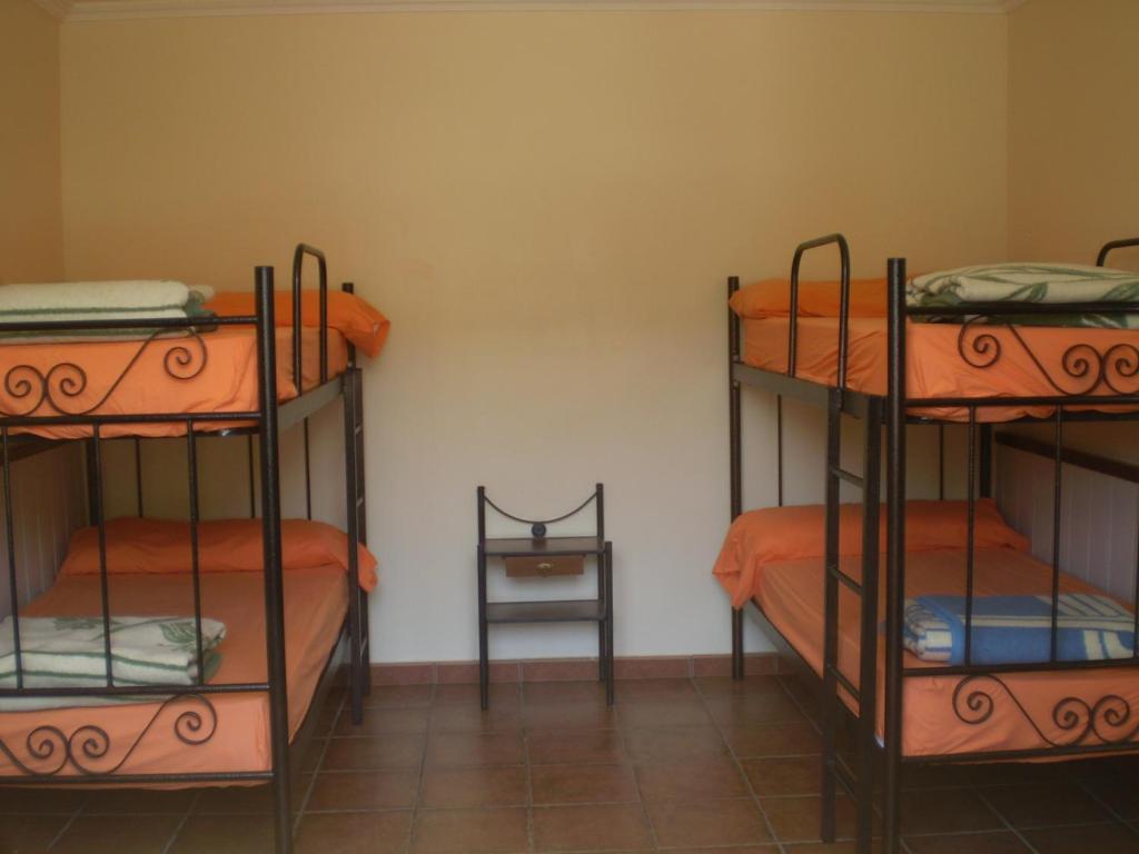 Postel nebo postele na pokoji v ubytování Pensión Albergue A Pedra