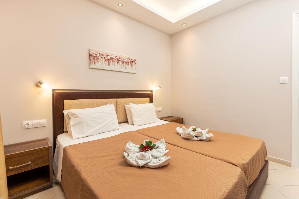 Postel nebo postele na pokoji v ubytování Rapanos Apartments