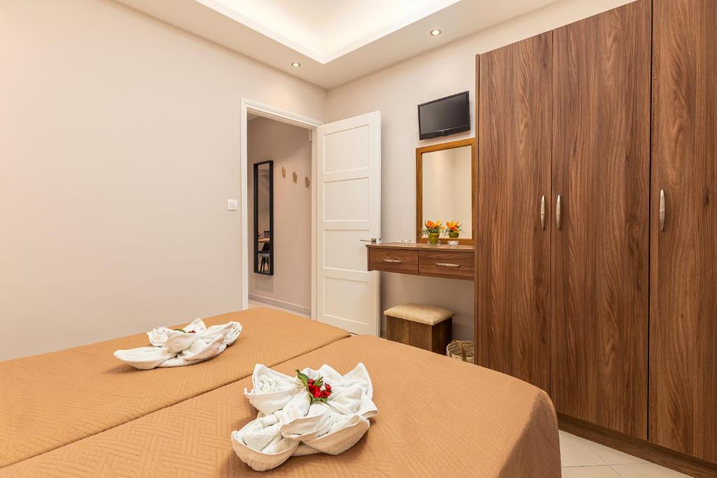 Postel nebo postele na pokoji v ubytování Rapanos Apartments