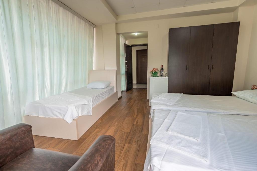 Postel nebo postele na pokoji v ubytování Hotel Orbita Ureki