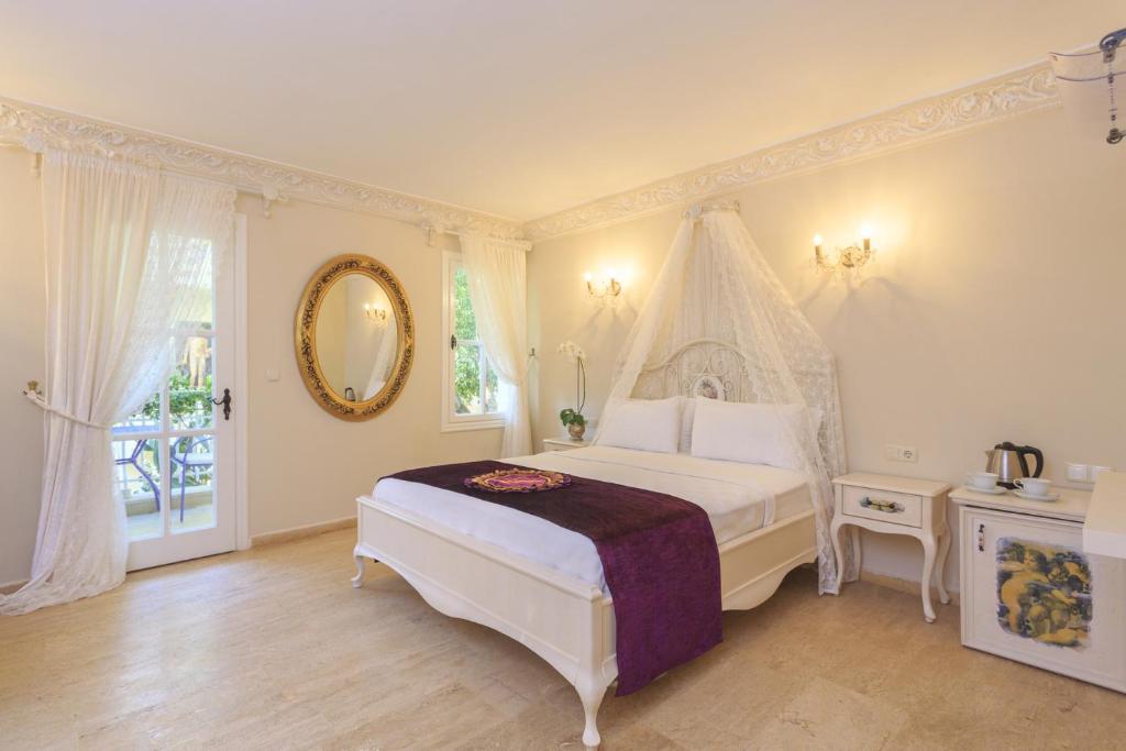 Postel nebo postele na pokoji v ubytování Lukka Exclusive Hotel – Adult Only +12