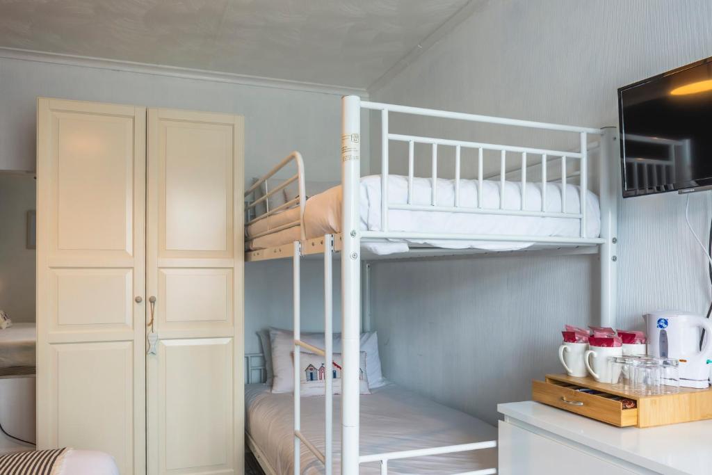 Kuchyň nebo kuchyňský kout v ubytování The Royson Guest House