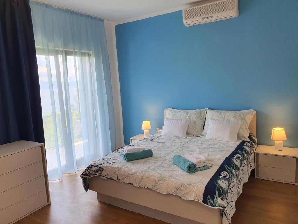 Posteľ alebo postele v izbe v ubytovaní APARTMAN VIDA 2