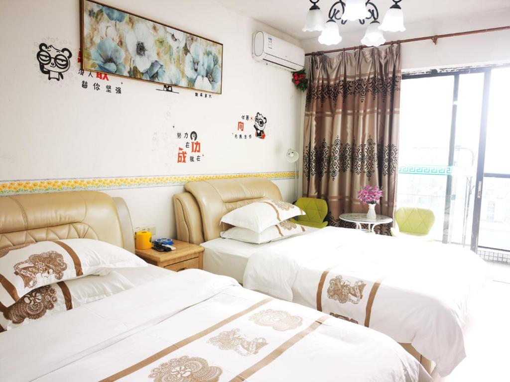 Krevet ili kreveti u jedinici u objektu Guangzhou Victory Apartment