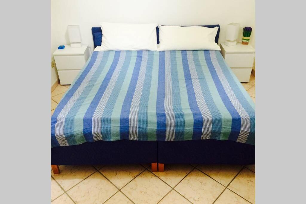Postel nebo postele na pokoji v ubytování Sunset Alghero