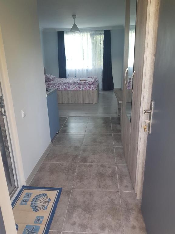 Llit o llits en una habitació de Guest House Sando
