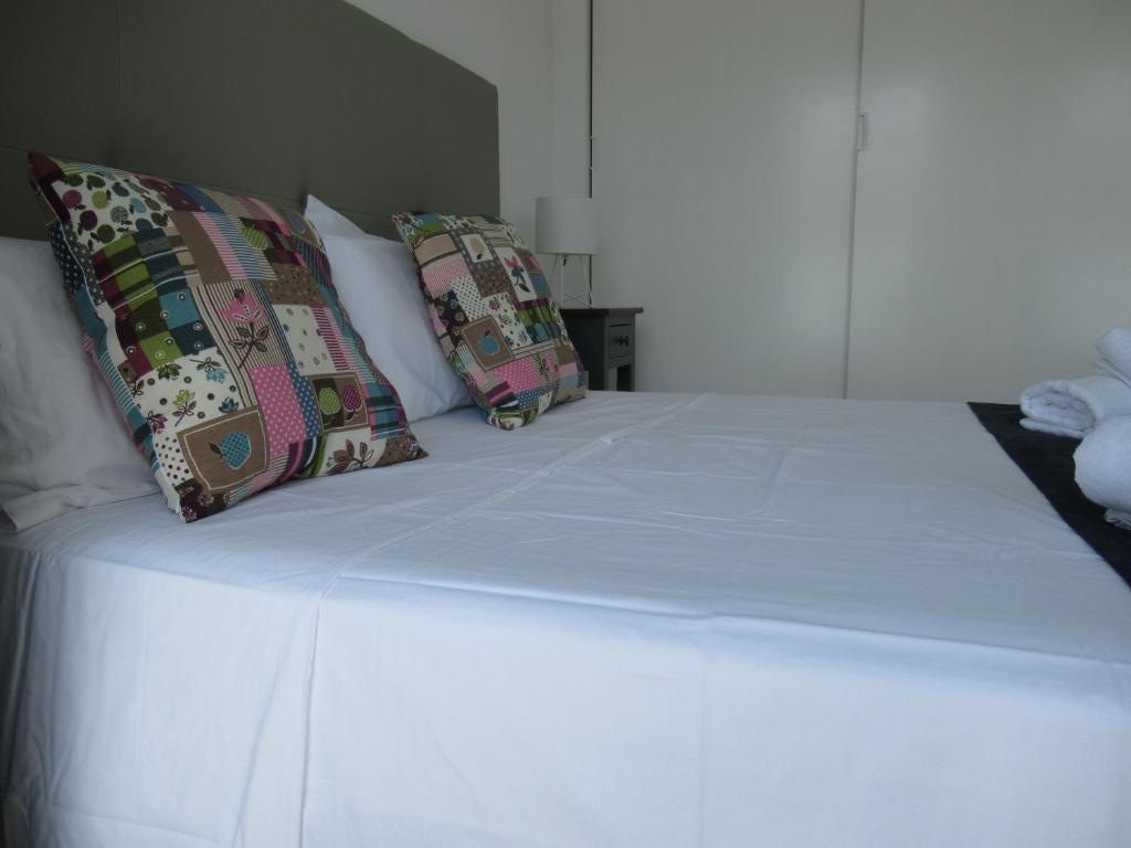 A bed or beds in a room at La Rosita Sun Apartments, by Comfortable Luxury
