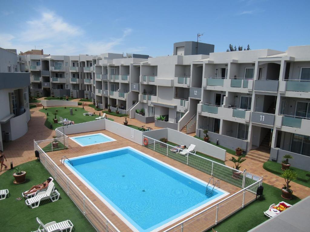 The swimming pool at or close to La Rosita Sun Apartments, by Comfortable Luxury