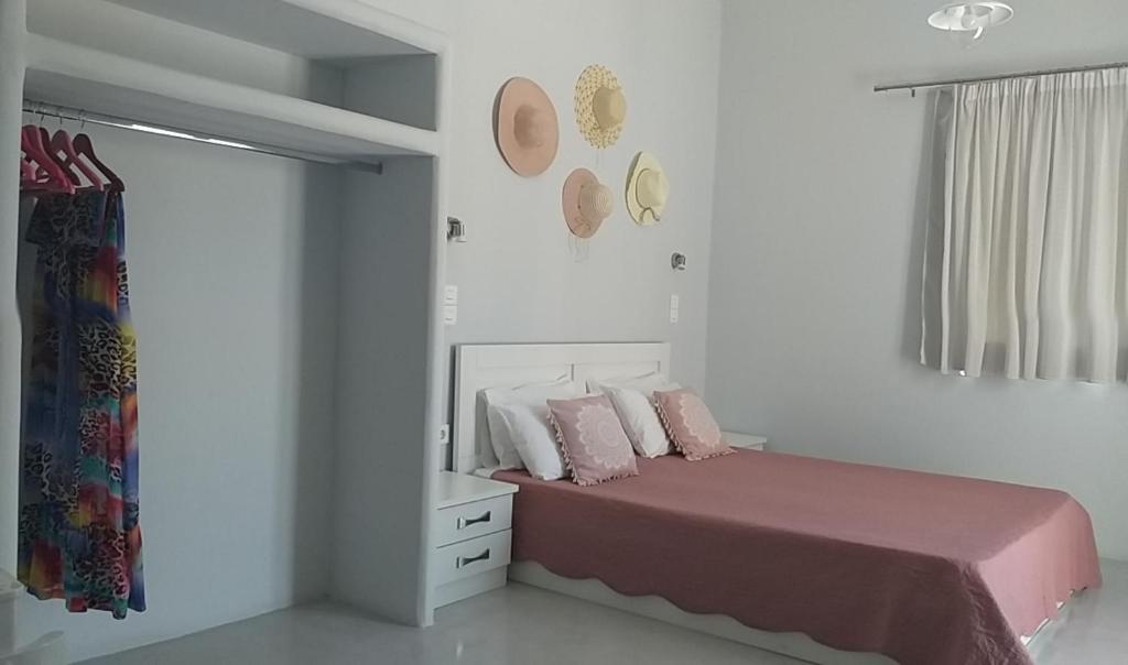 Łóżko lub łóżka w pokoju w obiekcie Passos Rooms