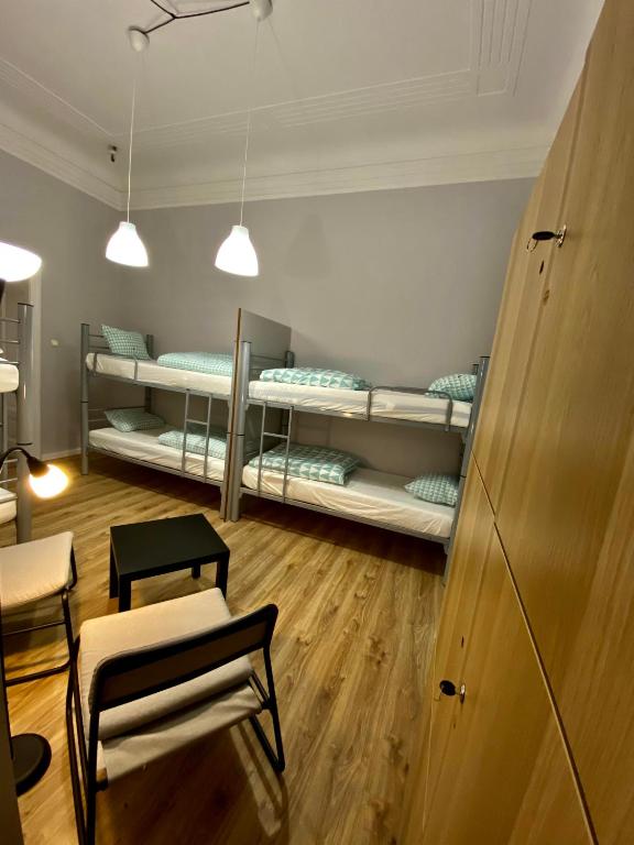Posteľ alebo postele v izbe v ubytovaní SKY HOSTEL