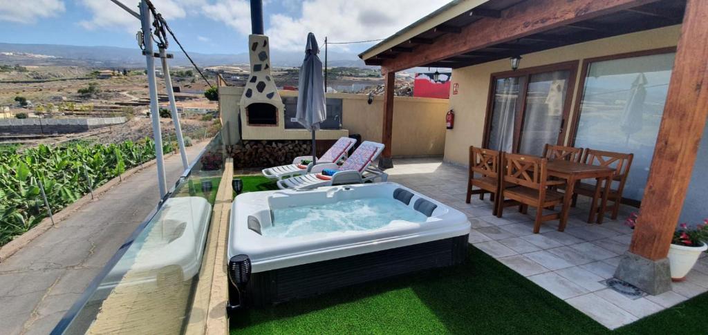 a hot tub on the patio of a house at La Casita in Playa de San Juan
