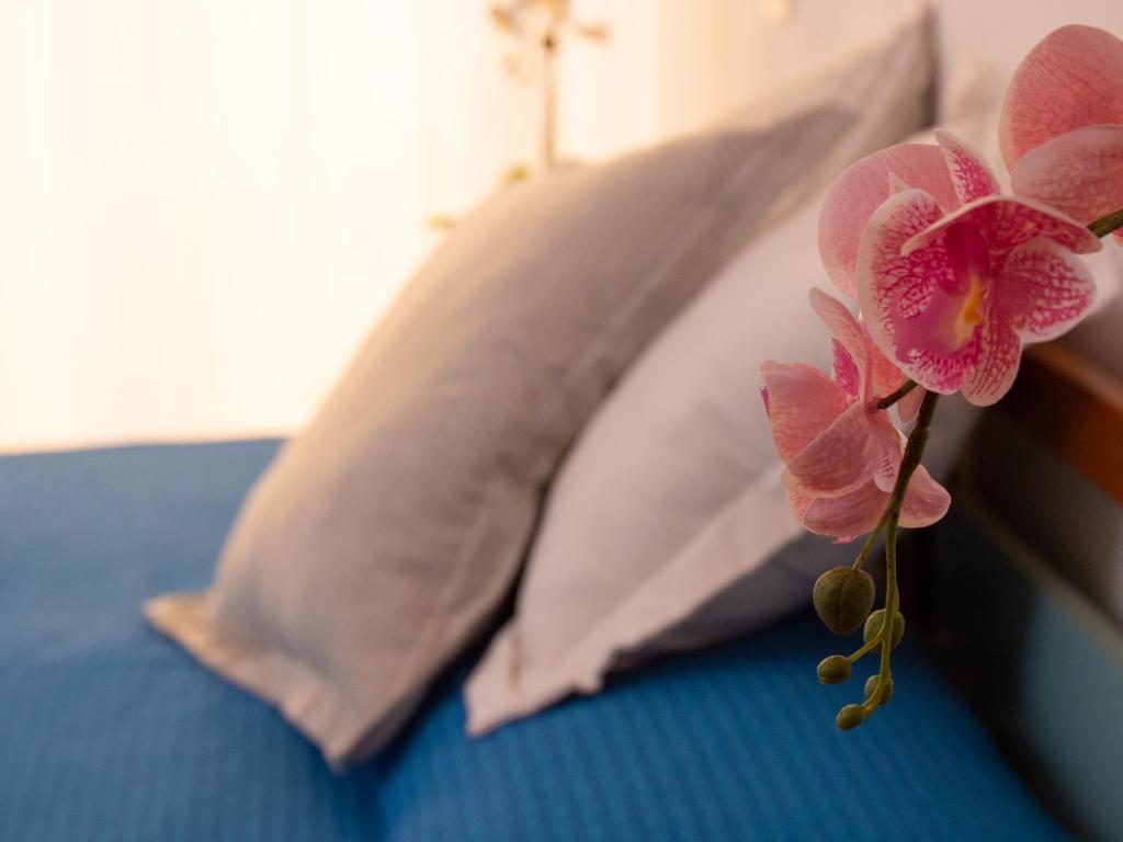 Postel nebo postele na pokoji v ubytování Hotel Merano