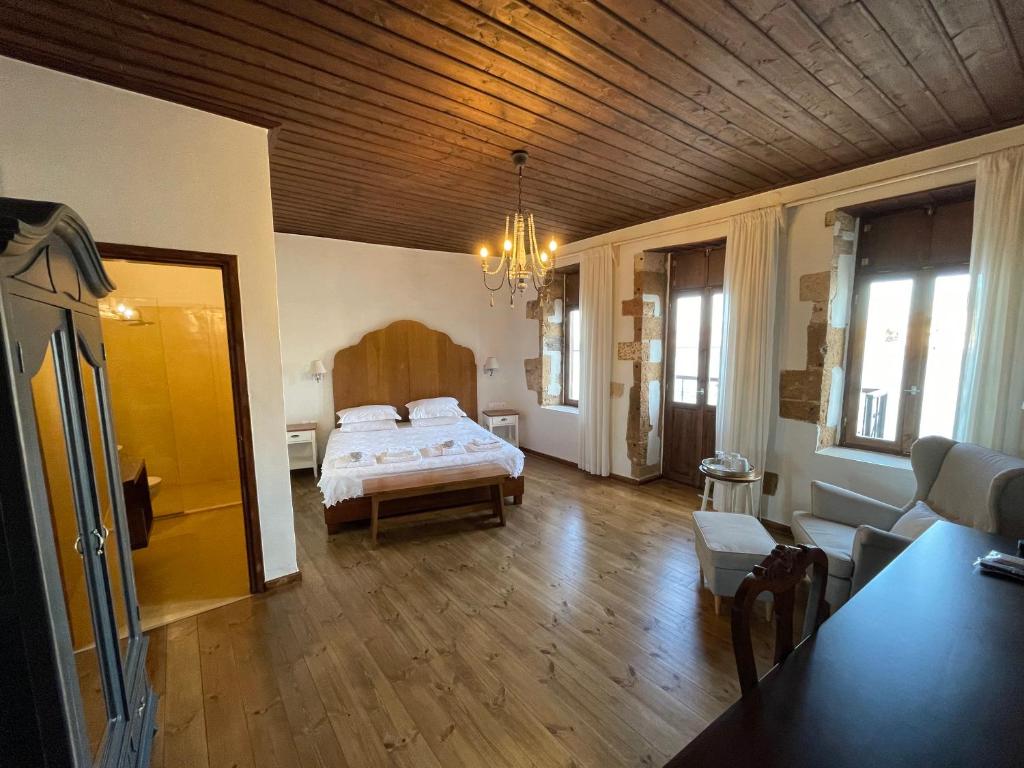 Postel nebo postele na pokoji v ubytování Captain Vasilis Hotel