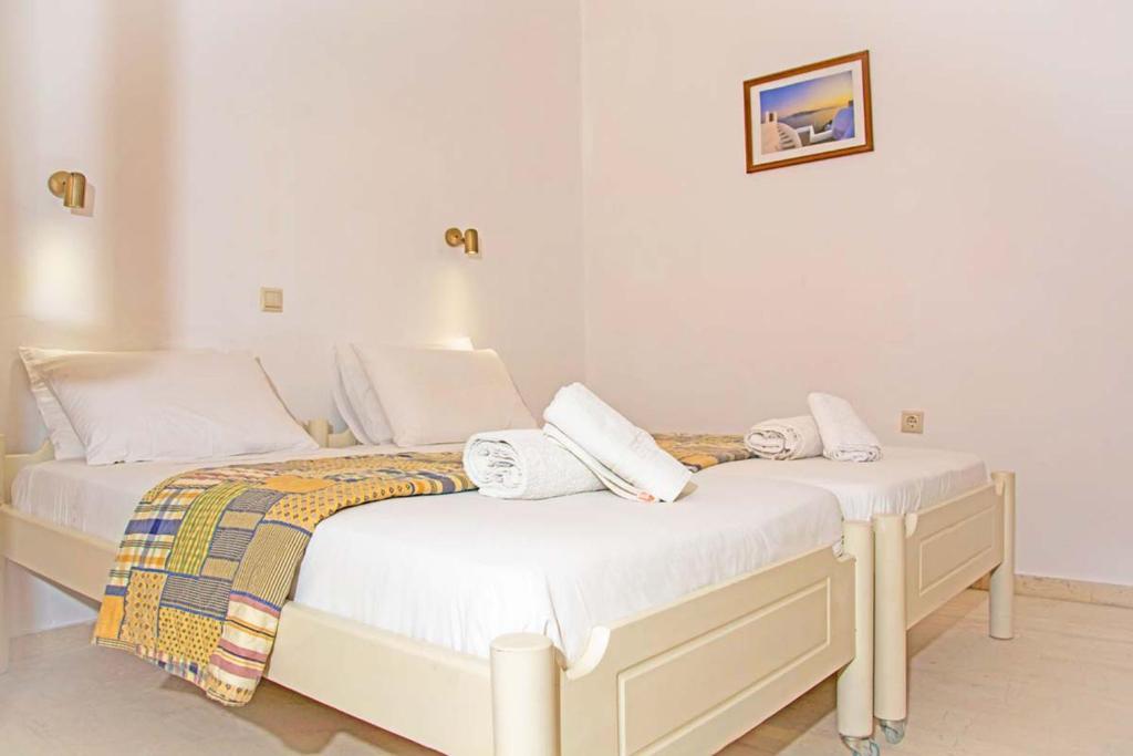 Postel nebo postele na pokoji v ubytování Seafront Apartments