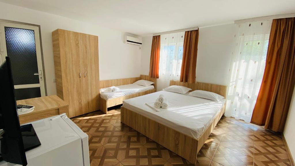 Postel nebo postele na pokoji v ubytování Vila Yzabelle
