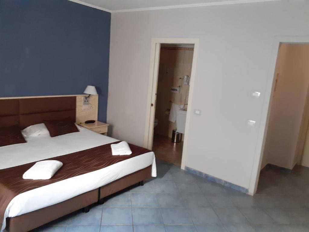 Кровать или кровати в номере Hotel Soleluna