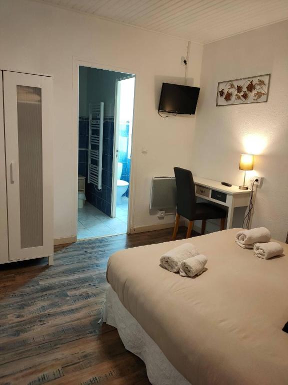 Postel nebo postele na pokoji v ubytování Hotel du Levant