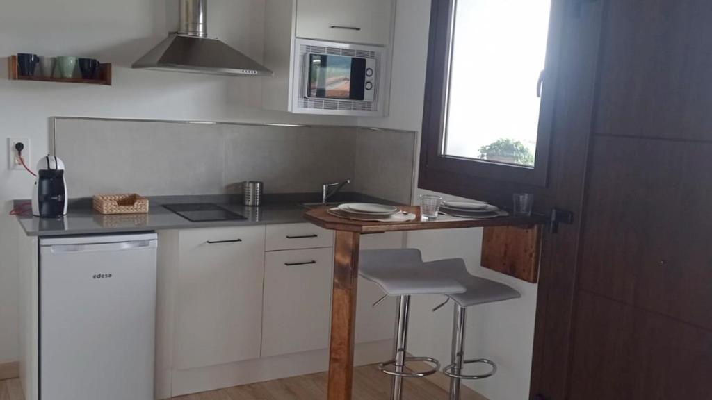 Kuchyň nebo kuchyňský kout v ubytování Apartamentos El Respigu