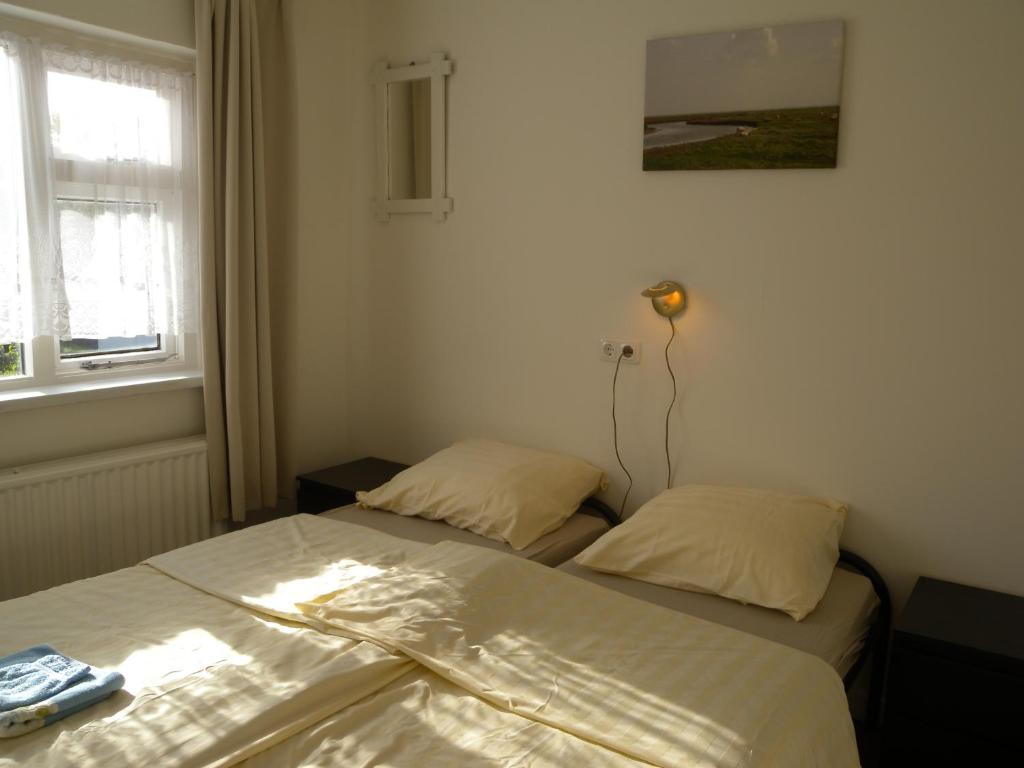 Postel nebo postele na pokoji v ubytování B&B Nobel