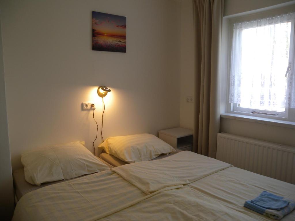 Postel nebo postele na pokoji v ubytování B&B Nobel
