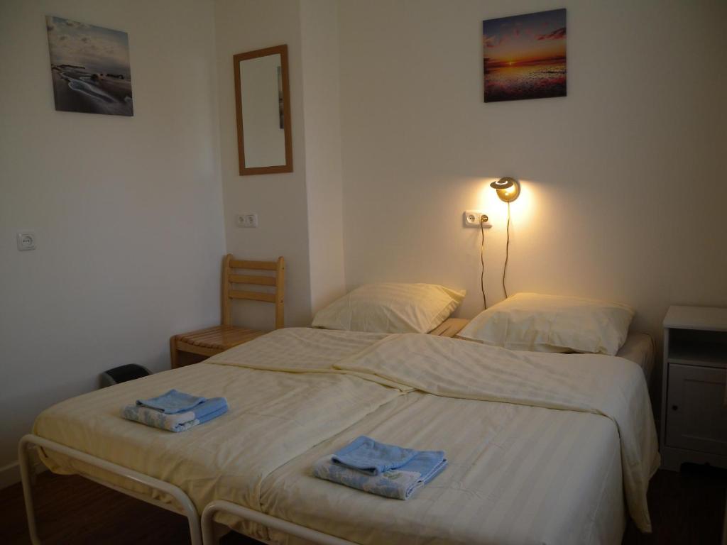Postel nebo postele na pokoji v ubytování B&B Nobel