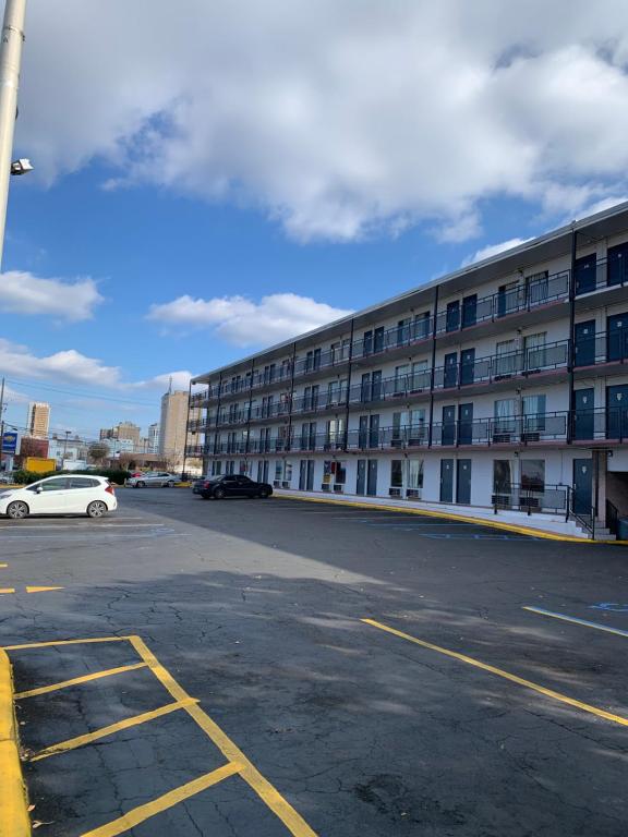 an empty parking lot next to a large building at Kings Inn Civic Center/UAB in Birmingham